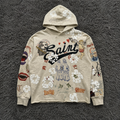 SAINT MxxxWxxx Graffiti Collage Hoodie - Distressed Saint/Reaper Graphic